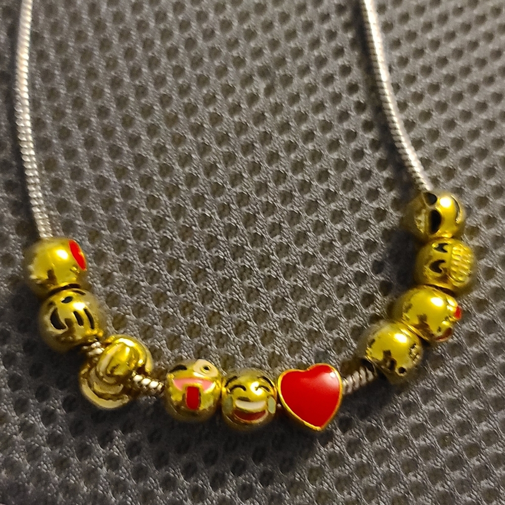 Emoji charm necklace silver and gold tones